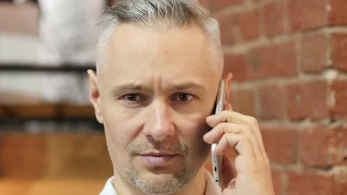 Close Up of Phone Talk of Middle Age Man