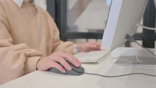 Close up of Female Hand Using Computer Mouse