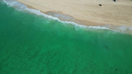 Sea Waves Breaking on Sand Beach