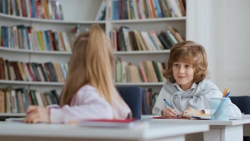 Happy Primary Students Drawing Pictures During Art Lesson at School Positive Girl Showing Her Work
