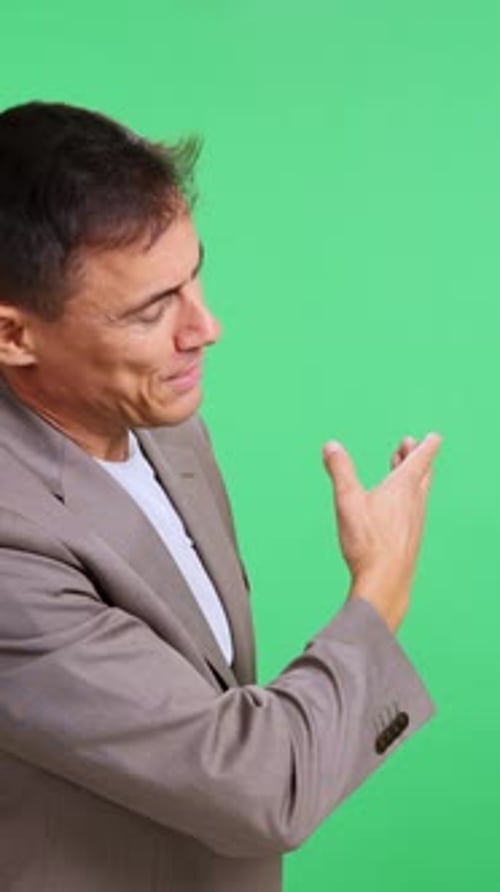 Expressive Man Presenting a Concept on a Green Screen
