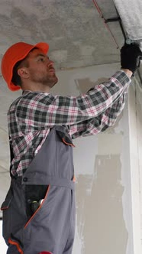 Skilled Technician Installs Ceiling Ventilation in Office
