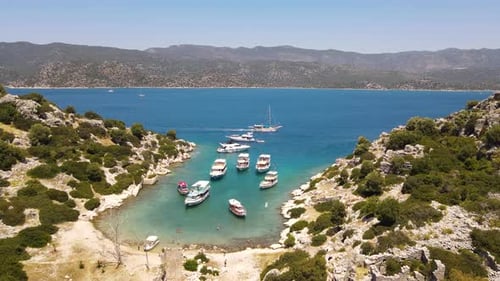 Beautiful view of the beach with boats, pure nature, sea and ships. Shot from a drone.