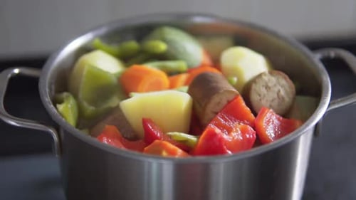 Vegetable stew of chopped eggplant and zucchini boiling in pot