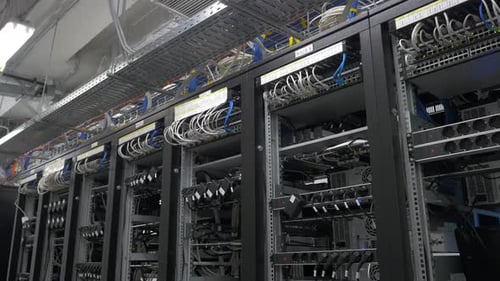 The Modern Infrastructure of Data Centers Often Includes Intricate Network Racks and Cables
