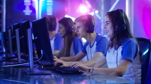 Team of Teenage Gamers Get Ready for eSport Tournament, Put on Their Headsets. Tournament Area/ Int