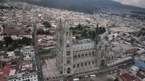 Aerial circling shot of ancient Basilica del voto national in capital of Ecuador