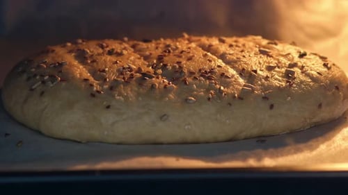 Bread with Seeds Baking in Oven