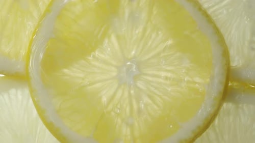 Refreshing Lemon Slices with Falling Water Droplets