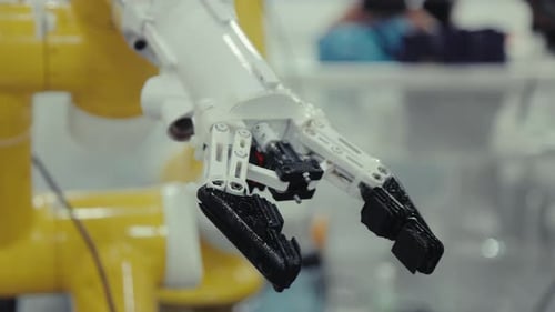 Close Up of Robotic Arm in Factory