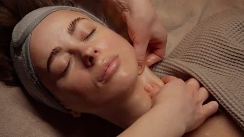 Relaxing Face Massage for Woman in Spa Setting