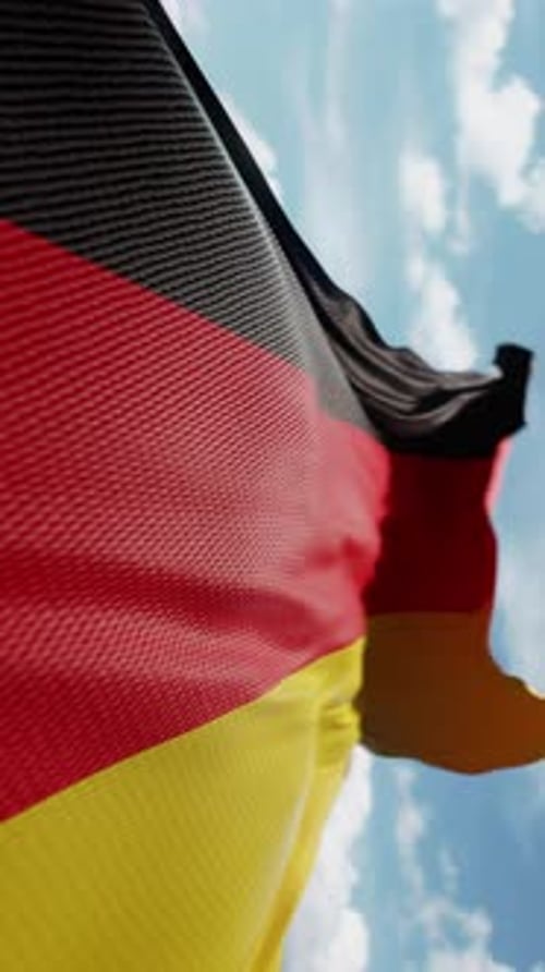 Waving German Flag Animation Against Blue Sky