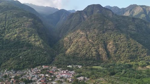 Aerial view of mountains and some city in Italy from a drone