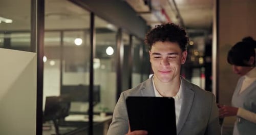 Walking, night and businessman on tablet in office for research, project review and online proposal