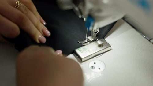 Close up Sewing Machine Stitching Black Material