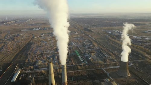 Aerial View of Thermal Power Plant Drone Flies Over Chimney Smoke Pipes and Cooling Towers of