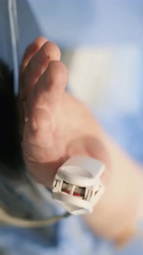 Adult Hand with Pulse Oximeter Close Up