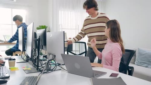 Group of young attractive business people working in office workplace.