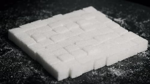 Sugar Cubes are Folded in a Square Shape Rotates CloseUp