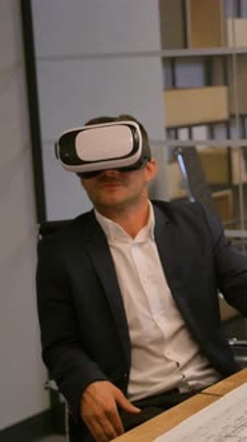 Man Using VR Headset in a Modern Office