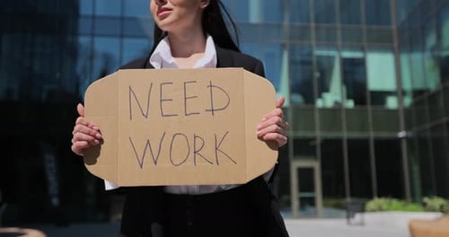 Close Up Woman Holding Poster Cardboard with Need Job Jobless Message Global Unemployment