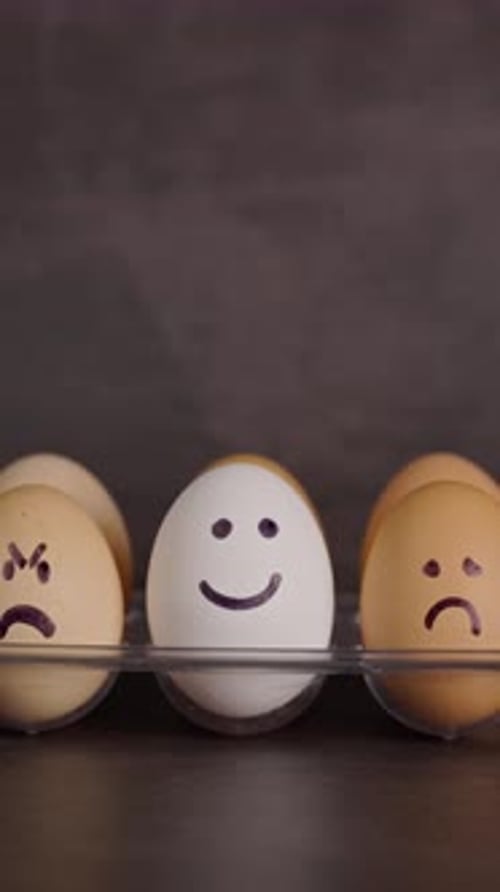 Three Eggs with Happy, Sad, and Angry Expressions