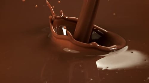 Pouring Liquid Chocolate Creating Splash Droplets in Slow Motion