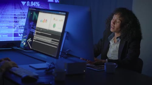A Professional Woman Expertly Analyzing Data in a Modern and Collaborative Office Environment