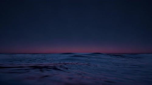 Water Waves Surface In Ocean. Beautiful Night Sky