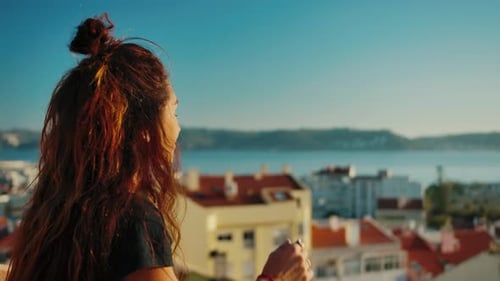 Attractive Woman Outdoors in Sun at Summer Day Looking at Beautiful Background