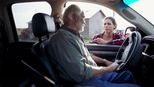Farmer Father and Daughter Talking at Pickup Truck on Farm 10 Seconds or Greater