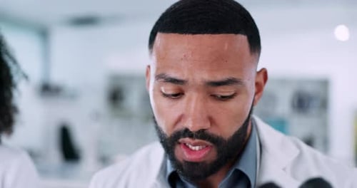 Scientist Working with Microscope in Modern Laboratory