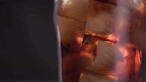 Iced Beverage Refreshes on a Dark Background
