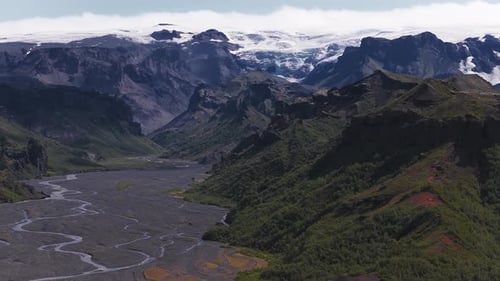 Aerial View of Glacial Valley with Braided River and Glacier in Iceland