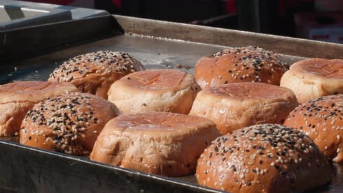 Closeup View of a Fresh and Flavorous Baked Buns Covered in Seeds