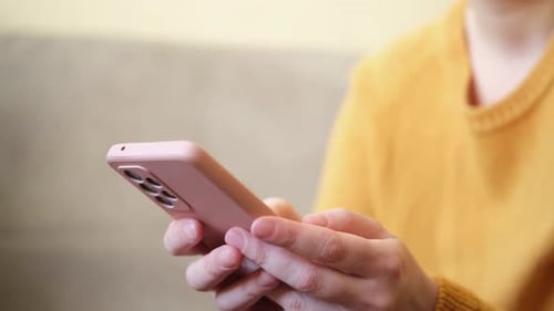 Person Using a Smartphone in Close Up