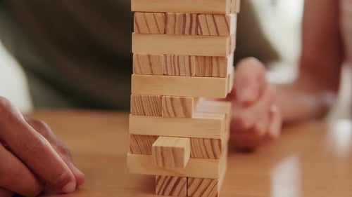 Couple Playing Jenga at Home