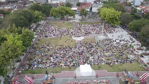 An aerial footage of Muslim congregation praying Eid in the field