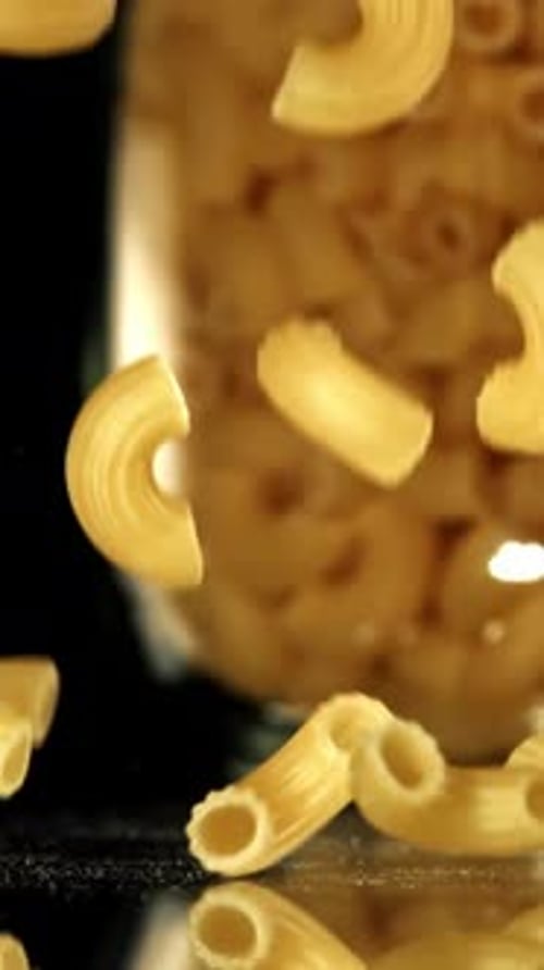 Super Slow Motion Dry Macaroni Pasta Filmed on a Highspeed Camera at 1000 Fps
