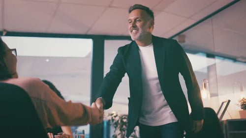 Business Handshake in Modern Office Environment