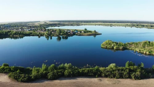 Aerial View of Serene Lake and Rural Village