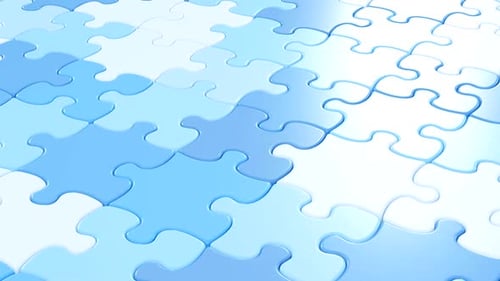 Blue puzzle pieces on light background