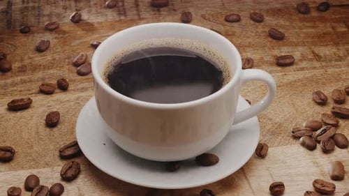 Coffee in a Cup with Coffee Beans