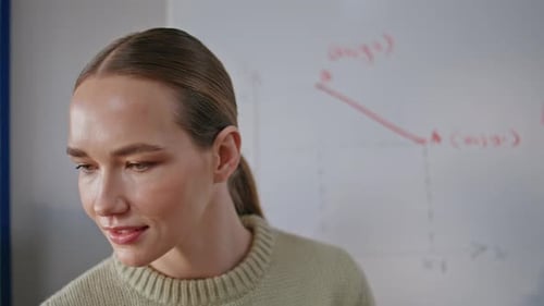 Serious Educator Writing Board at Cabinet Closeup Lady Talking to Auditorium