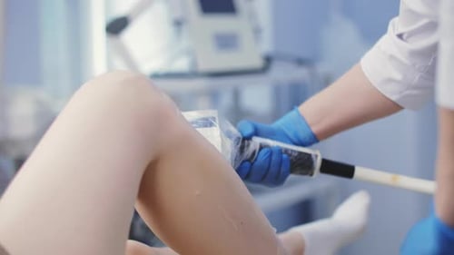 Laser Hair Removal Procedure on Female Legs in Clinic