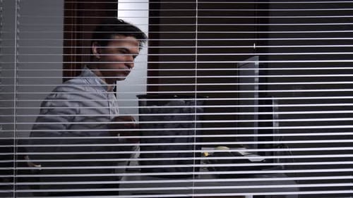 Office Worker Feeling Frustrated and Overwhelmed Discarding Crumpled Paper Into a Waste Basket