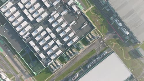 Drone shot of a large scale data center facility in a modern technology park.