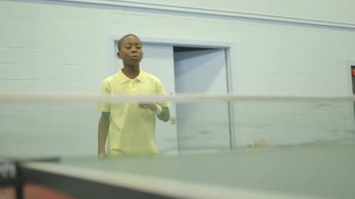 MS Boy playing table tennis in court