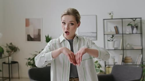 Woman Using Sign Language in Modern Living Room