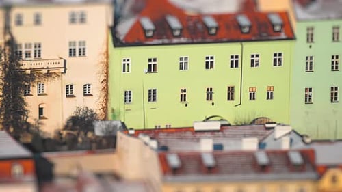 Aerial view of the houses in Prague's old town. A thin layer of fresh snow on the roofs and on the g